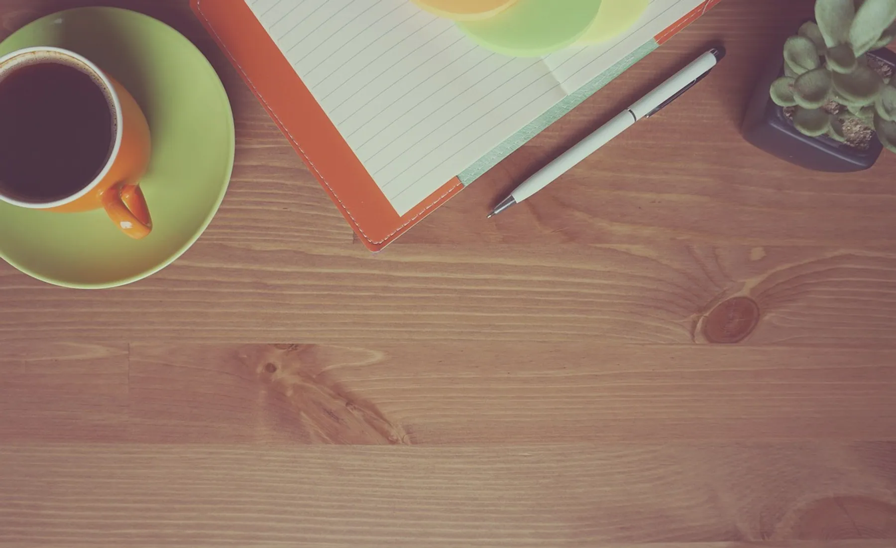 Coffee, notebook and wooden